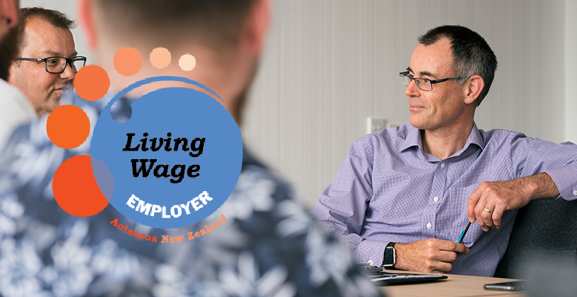 Living wage employer logo siting on Booster employees lifestyle image